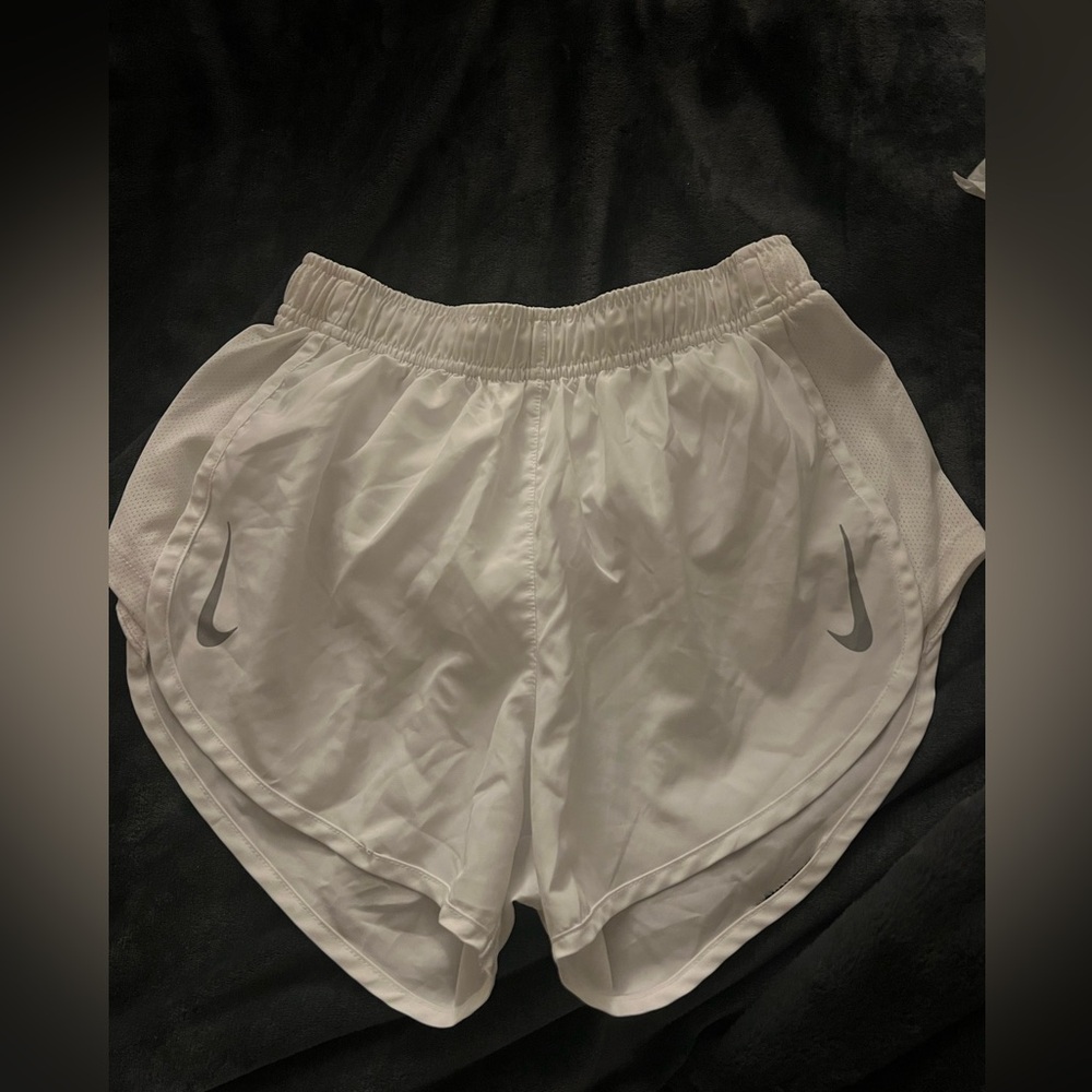 Nike white running shorts- small tear on back